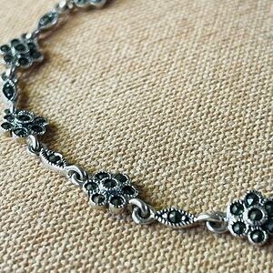 Elegant Silver Floral Bracelet with Intricate Detailing